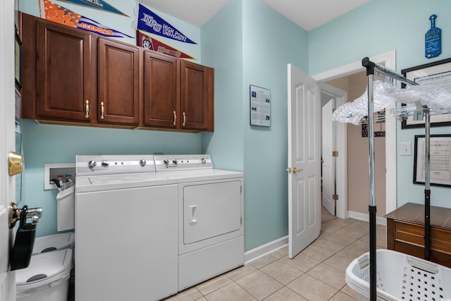 190 Barony Pl, Pawleys Island, SC 29585 - clothes washing area with cabinet space, independent washer and dryer, light tile patterned floors, and baseboards