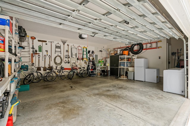 190 Barony Pl, Pawleys Island, SC 29585 - garage featuring washer / dryer, freestanding refrigerator, and fridge