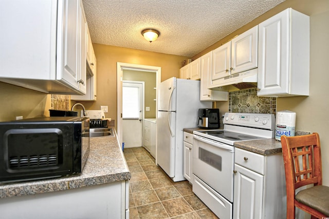 kitchen with white appliances, a sink, under cabinet range hood, white cabinets, and a textured ceiling