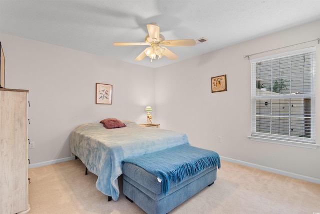 bedroom featuring carpet floors, baseboards, and a ceiling fan
