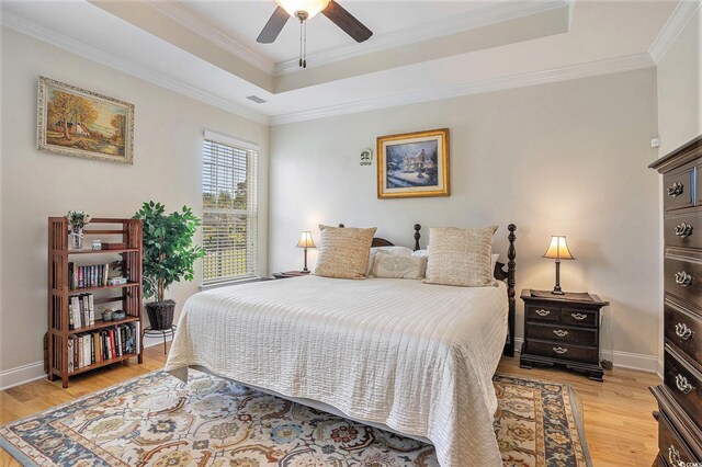 967 Henry James Dr, Myrtle Beach, SC 29579 - bedroom featuring a raised ceiling, light wood-style floors, crown molding, baseboards, and ceiling fan