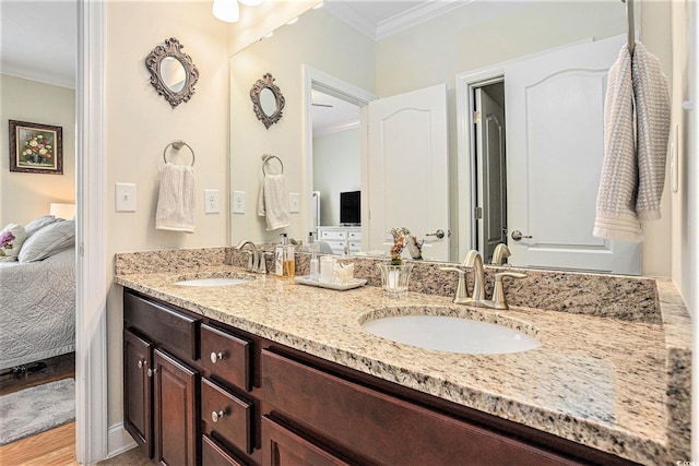 967 Henry James Dr, Myrtle Beach, SC 29579 - ensuite bathroom with crown molding, double vanity, and wood finished floors