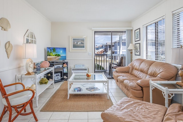 living room with light tile patterned floors and ornamental molding