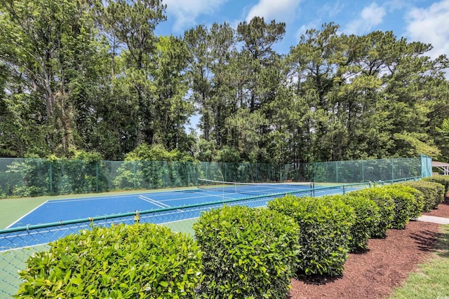view of tennis court with fence
