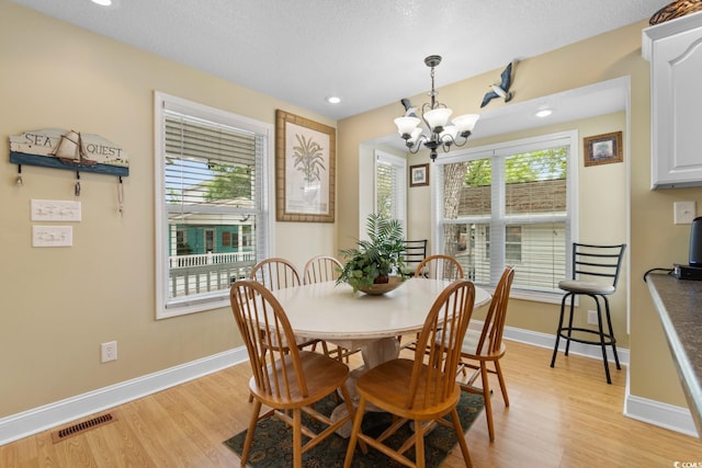 6001 S Kings Hwy, Myrtle Beach, SC 29575 - dining room with light wood-style floors, a chandelier, baseboards, and recessed lighting