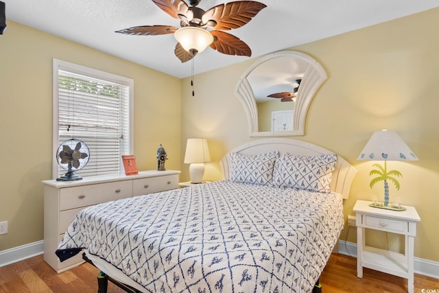 6001 S Kings Hwy, Myrtle Beach, SC 29575 - bedroom with baseboards, wood finished floors, and a ceiling fan