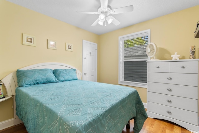 6001 S Kings Hwy, Myrtle Beach, SC 29575 - bedroom with wood finished floors, baseboards, and ceiling fan