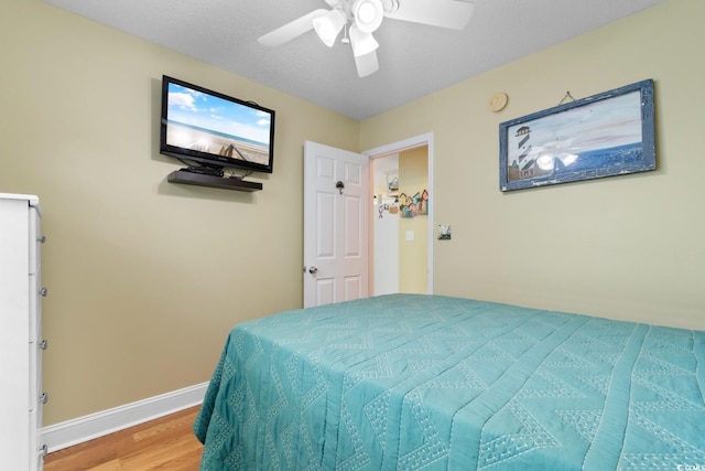 6001 S Kings Hwy, Myrtle Beach, SC 29575 - bedroom featuring wood finished floors, baseboards, and ceiling fan