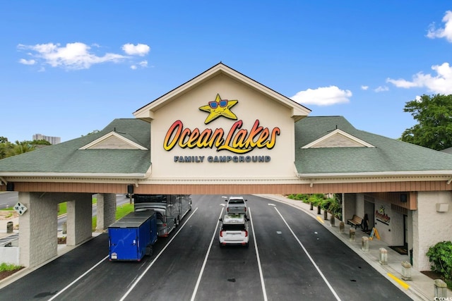 6001 S Kings Hwy, Myrtle Beach, SC 29575 - view of building exterior with covered and uncovered parking
