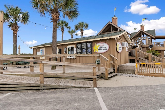 6001 S Kings Hwy, Myrtle Beach, SC 29575 - back of property featuring a deck and board and batten siding