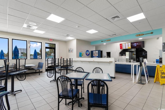 6001 S Kings Hwy, Myrtle Beach, SC 29575 - dining area with light tile patterned floors and a drop ceiling