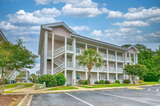 4683 Wild Iris Dr Unit 104, Myrtle Beach, SC 29577 - view of apartment building / complex with uncovered parking