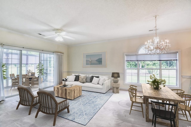 4683 Wild Iris Dr Unit 104, Myrtle Beach, SC 29577 - living area featuring plenty of natural light, a chandelier, ceiling fan, ornamental molding, and carpet flooring