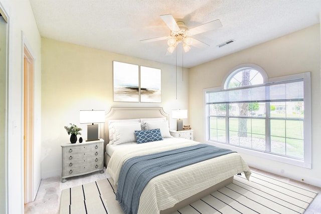 4683 Wild Iris Dr Unit 104, Myrtle Beach, SC 29577 - bedroom featuring baseboards, ceiling fan, and a textured ceiling