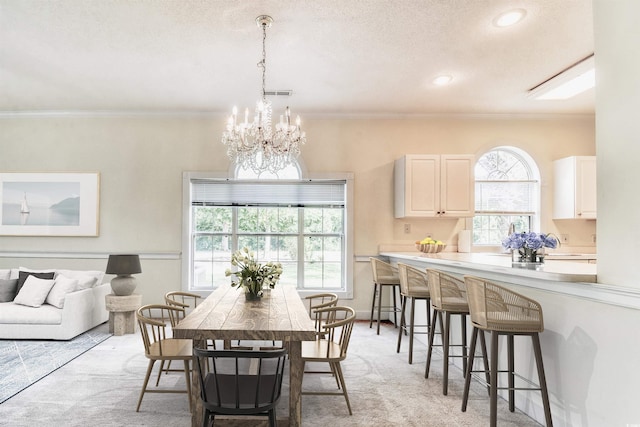 4683 Wild Iris Dr Unit 104, Myrtle Beach, SC 29577 - dining room with a chandelier, light carpet, healthy amount of natural light, ornamental molding, and recessed lighting