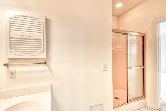 4683 Wild Iris Dr Unit 104, Myrtle Beach, SC 29577 - bathroom with radiator heating unit, a stall shower, and tile patterned floors