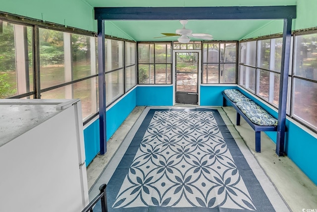 sunroom / solarium with a ceiling fan