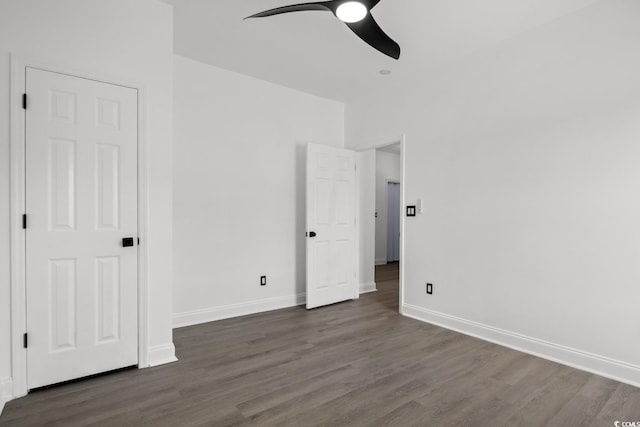 unfurnished bedroom featuring wood finished floors, baseboards, and ceiling fan