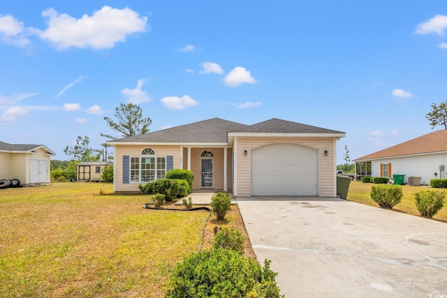 view of front of house featuring an attached garage, a front lawn, and driveway