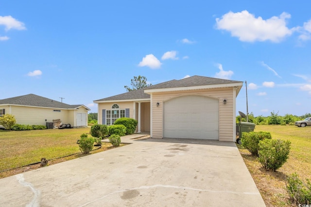 view of front of home with a front lawn, a garage, and driveway
