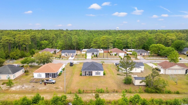 aerial view of residential area with a heavily wooded area