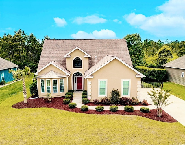 1367 Bermuda Grass Dr, Myrtle Beach, SC 29579 - traditional home featuring concrete driveway and stucco siding