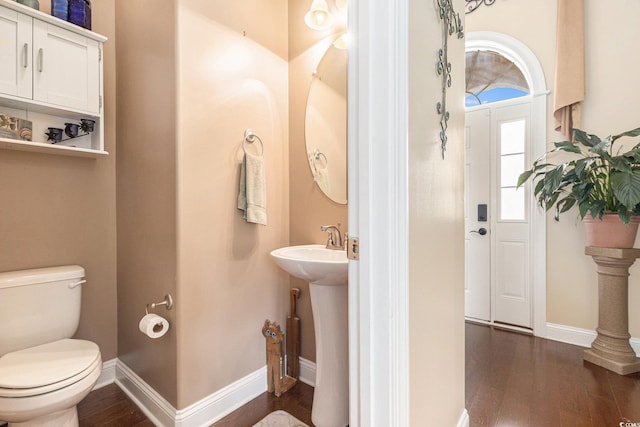 1367 Bermuda Grass Dr, Myrtle Beach, SC 29579 - bathroom featuring toilet, wood-type flooring, baseboards, and a sink