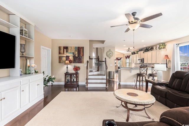 1367 Bermuda Grass Dr, Myrtle Beach, SC 29579 - living area with dark wood finished floors, stairway, a ceiling fan, and baseboards
