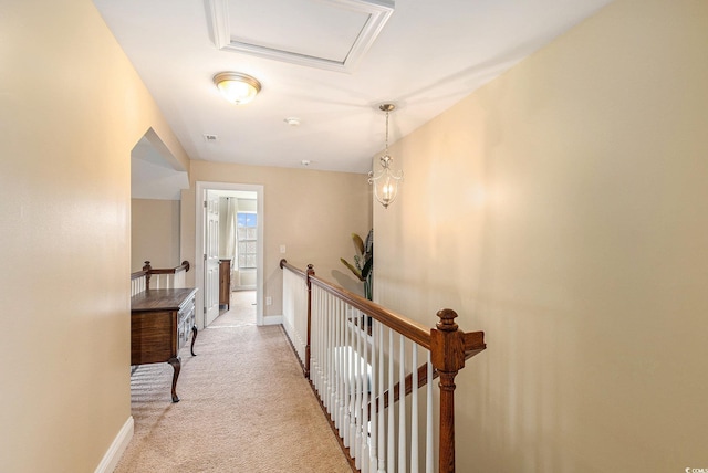 1367 Bermuda Grass Dr, Myrtle Beach, SC 29579 - hallway featuring an upstairs landing, light carpet, and baseboards