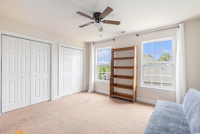 1367 Bermuda Grass Dr, Myrtle Beach, SC 29579 - living area with ceiling fan, light colored carpet, and baseboards