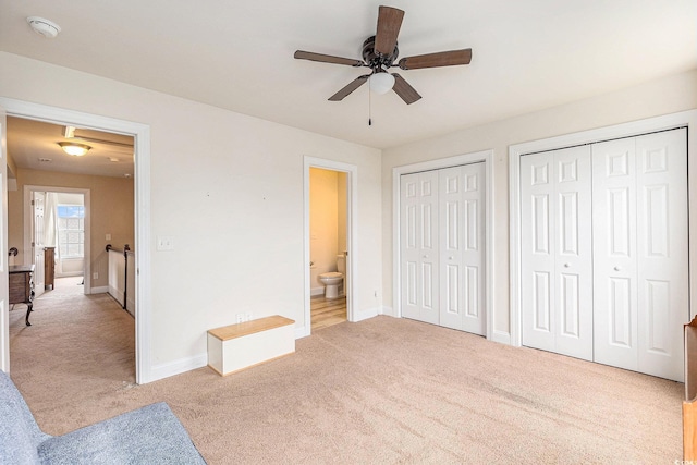 1367 Bermuda Grass Dr, Myrtle Beach, SC 29579 - unfurnished bedroom with carpet, multiple closets, baseboards, ensuite bath, and ceiling fan