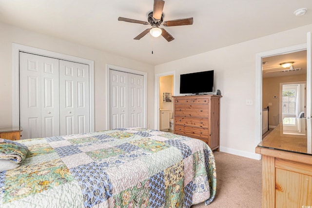 1367 Bermuda Grass Dr, Myrtle Beach, SC 29579 - bedroom with light carpet, multiple closets, baseboards, and ceiling fan