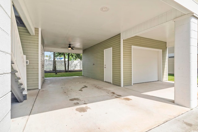 view of patio with a carport, a ceiling fan, and fence