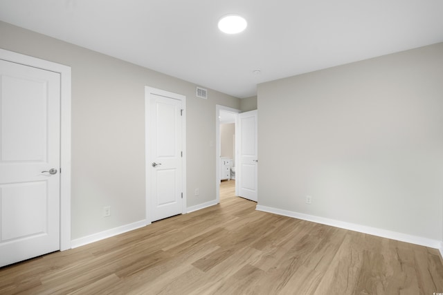 1015 Elm St Unit 4, Conway, SC 29526 - unfurnished bedroom with light wood finished floors and baseboards