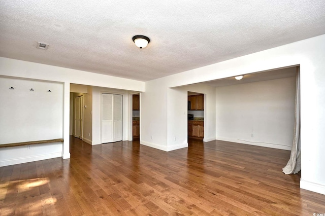 816 Kittiwake Ln, Murrells Inlet, SC 29576 - unfurnished room featuring wood finished floors, a textured ceiling, and baseboards