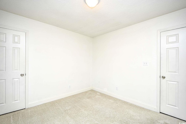 816 Kittiwake Ln, Murrells Inlet, SC 29576 - empty room with light colored carpet, baseboards, and a textured ceiling