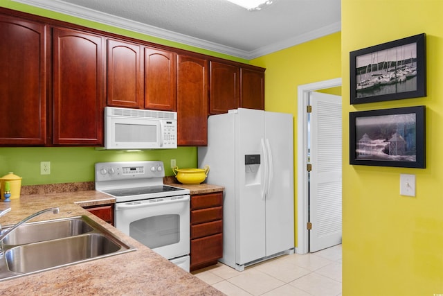 kitchen featuring white appliances, a sink, reddish brown cabinets, light tile patterned flooring, and ornamental molding