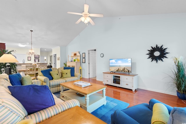 5840 Longwood Dr Unit 303, Murrells Inlet, SC 29576 - living room with wood finished floors, a chandelier, ceiling fan, high vaulted ceiling, and baseboards