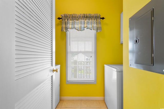 5840 Longwood Dr Unit 303, Murrells Inlet, SC 29576 - washroom with washer / dryer, light tile patterned floors, and baseboards