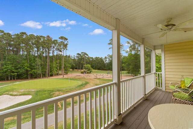 5840 Longwood Dr Unit 303, Murrells Inlet, SC 29576 - deck with a ceiling fan, a putting green, view of wooded area, and view of golf course