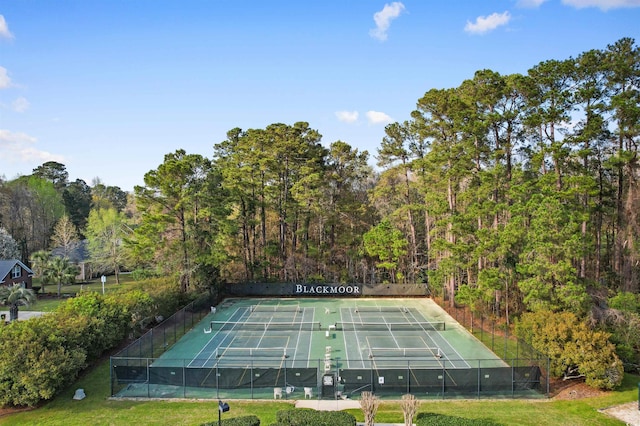 view of tennis court featuring fence