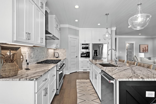 4832 Williams Island Dr, Little River, SC 29566 - kitchen featuring premium appliances, a sink, recessed lighting, wall chimney range hood, and dark wood-type flooring