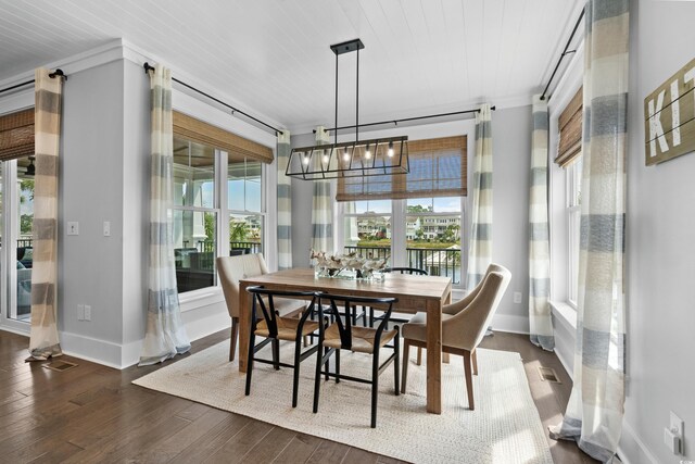 4832 Williams Island Dr, Little River, SC 29566 - dining space featuring a chandelier, dark wood-style floors, and baseboards
