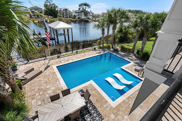 4832 Williams Island Dr, Little River, SC 29566 - view of pool featuring boat lift, a water view, fence, a patio area, and a boat dock
