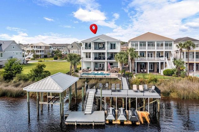 4832 Williams Island Dr, Little River, SC 29566 - dock featuring boat lift, a water view, a residential view, and an outdoor pool