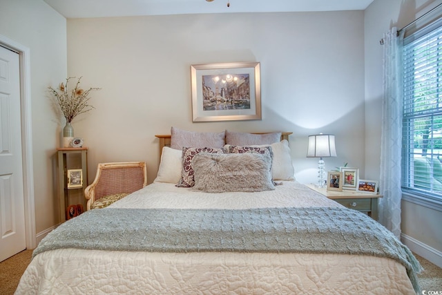 carpeted bedroom with baseboards