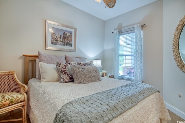 bedroom featuring baseboards and carpet flooring
