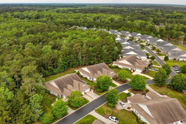 aerial view of residential area featuring a heavily wooded area
