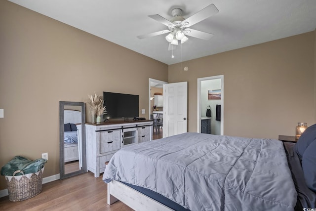 bedroom featuring wood finished floors, baseboards, and ceiling fan