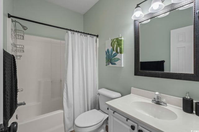 bathroom with toilet, shower / tub combo, and vanity